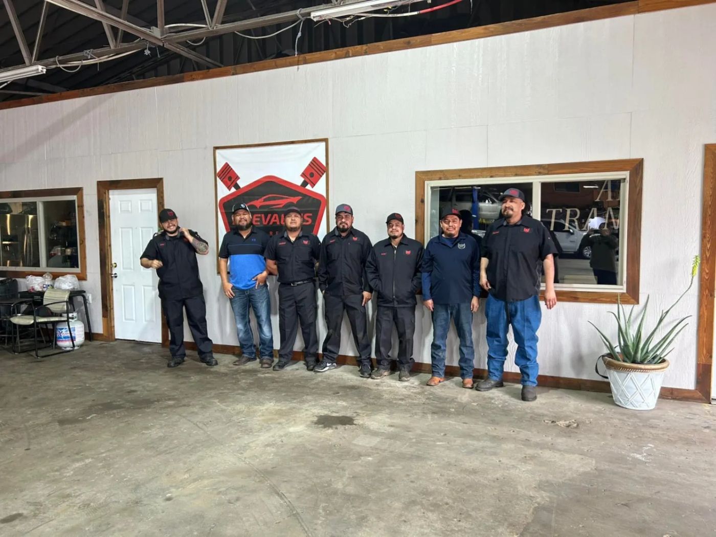 The Arevalo's Auto Repair crew inside the shop in Irving, Texas